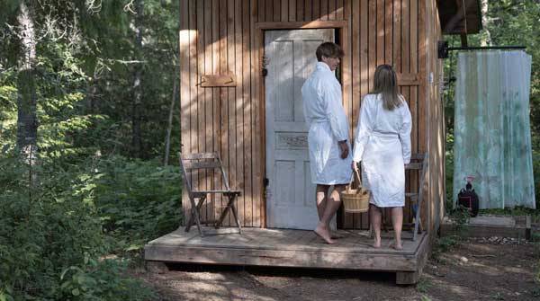 A couple in robes ready to sauna.