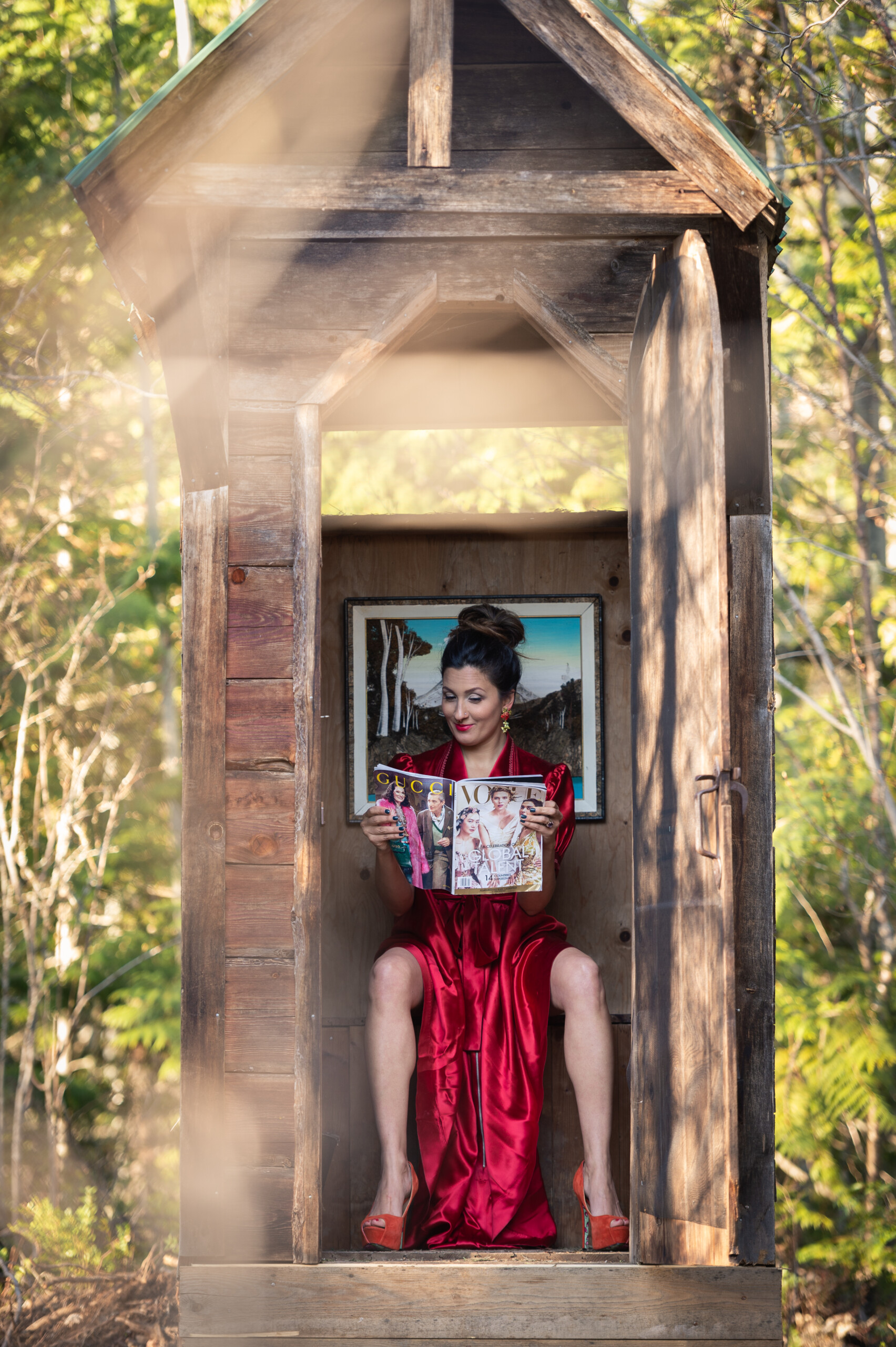 A fancy lady in an outhouse.