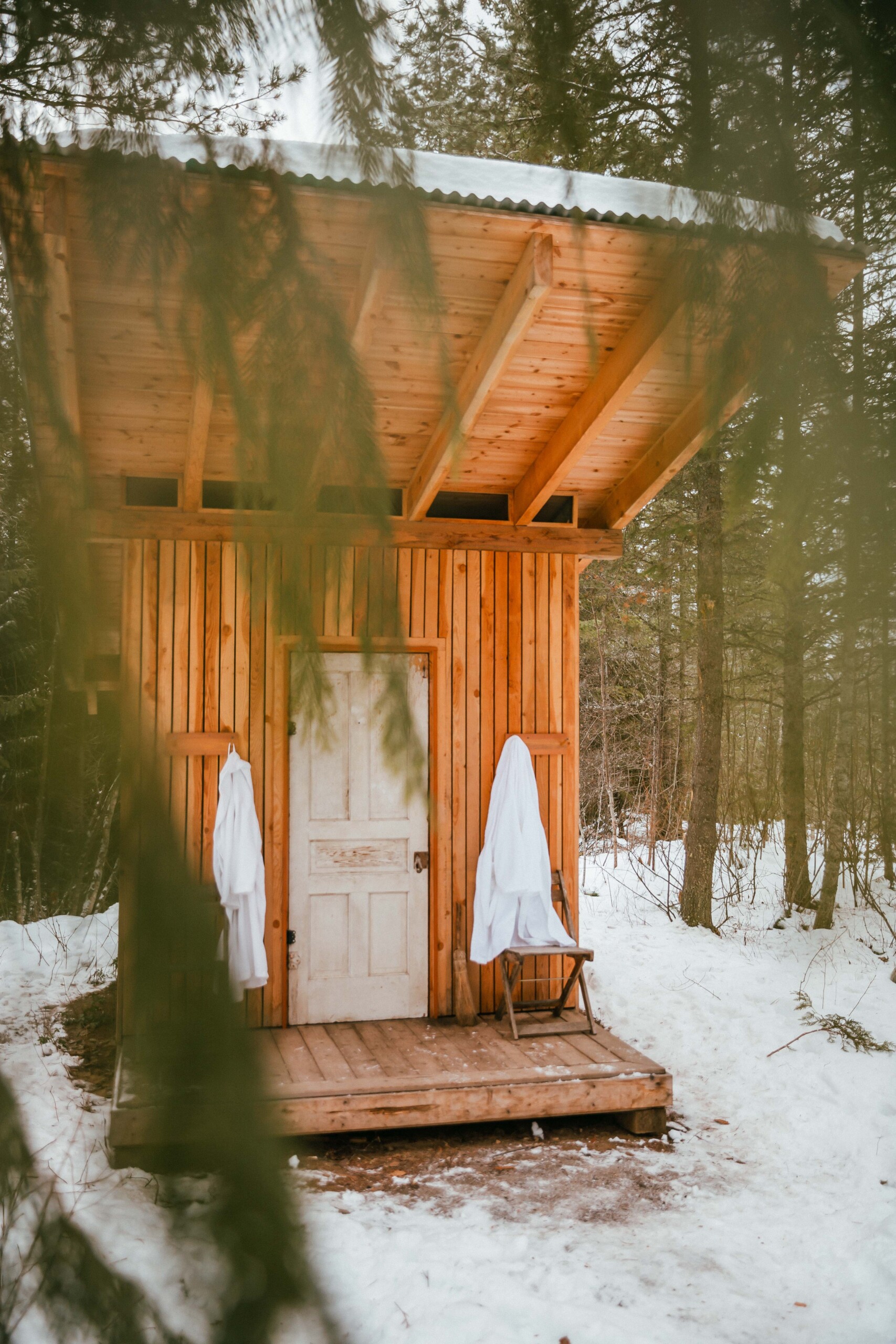 A wood-fired sauna with robes.