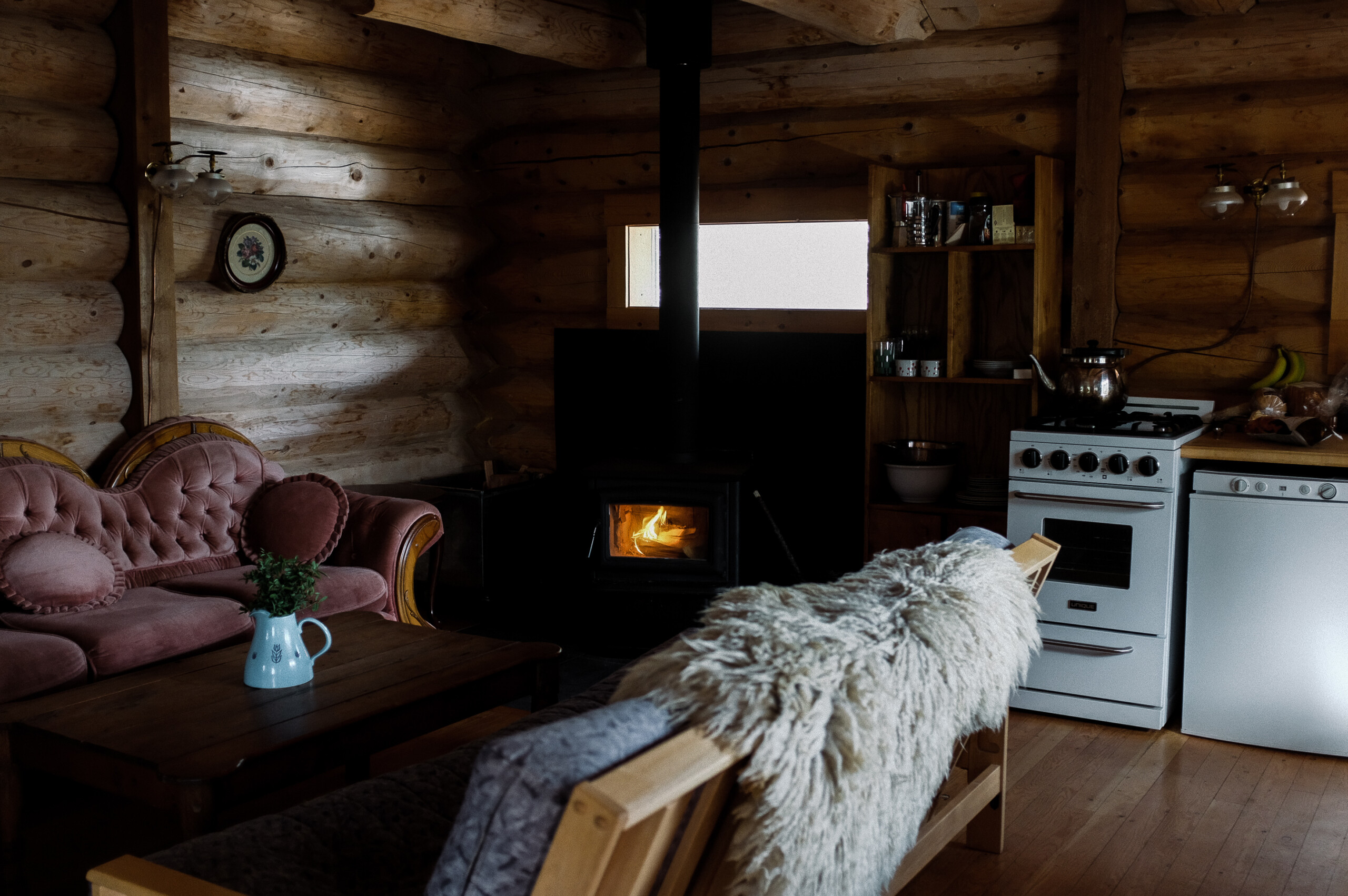 A cozy fire place in Wild Rose Cabin in the Larch Hills, BC.