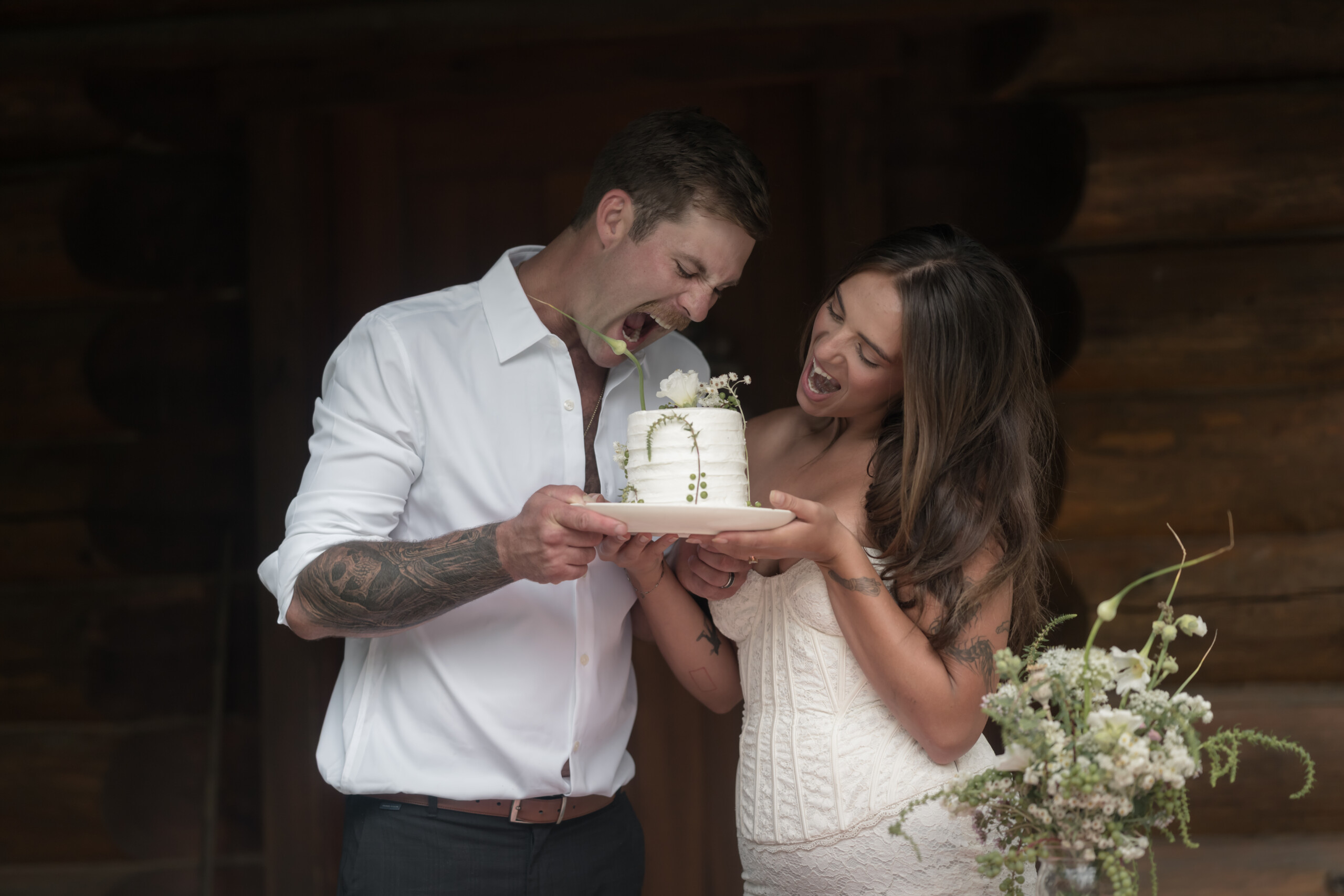 Bride and groom eating their elopement cake.