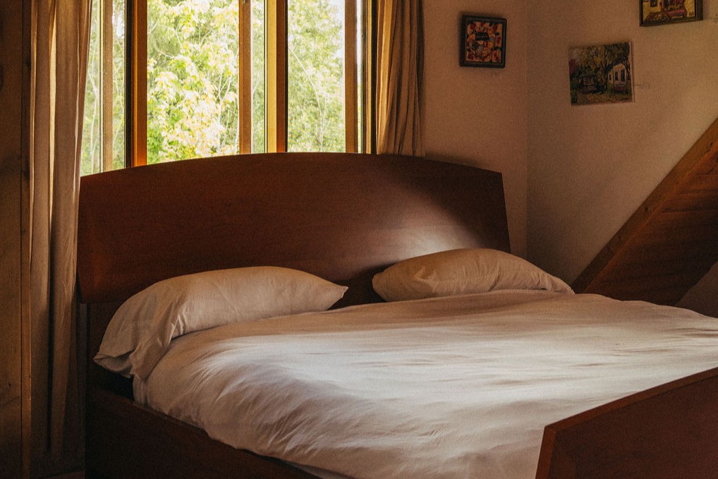 The king sized bed in Wild Rose Cabin near Salmon Arm, BC.