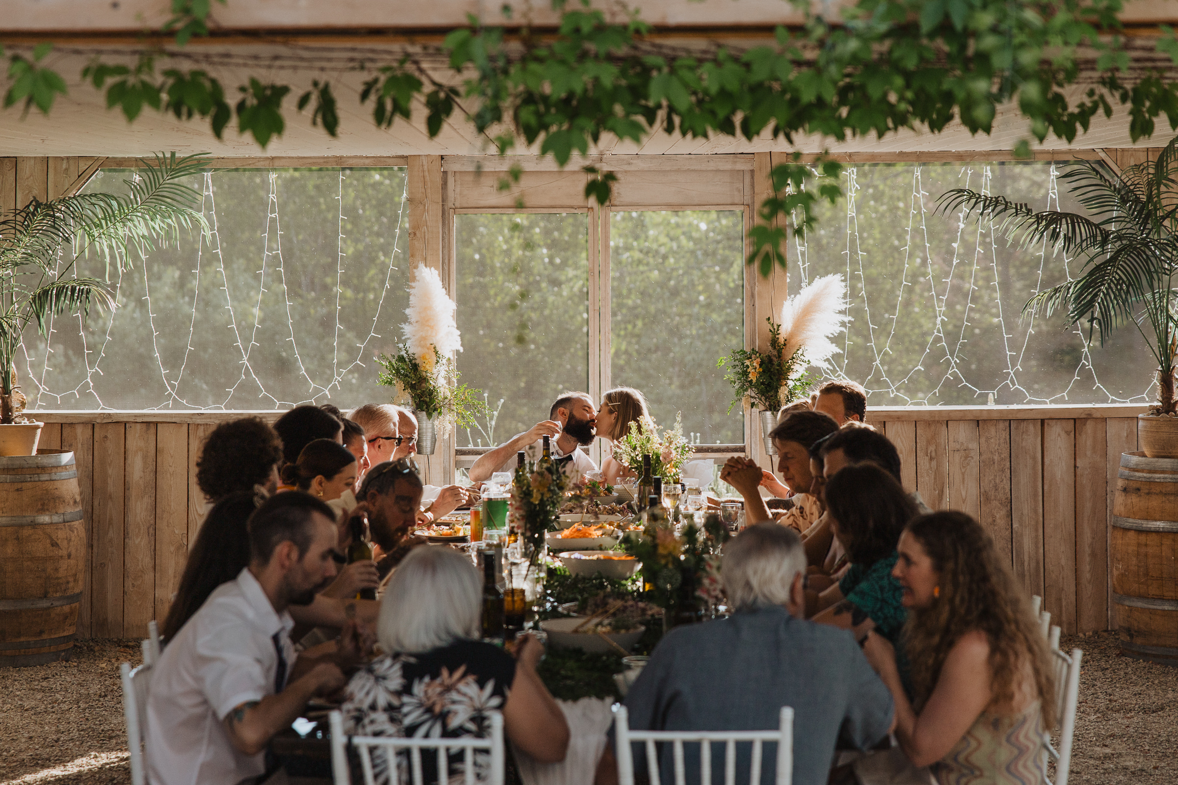 Cydney & Michael Guests enjoying an intimate outdoor wedding dinner surrounded by the forest.