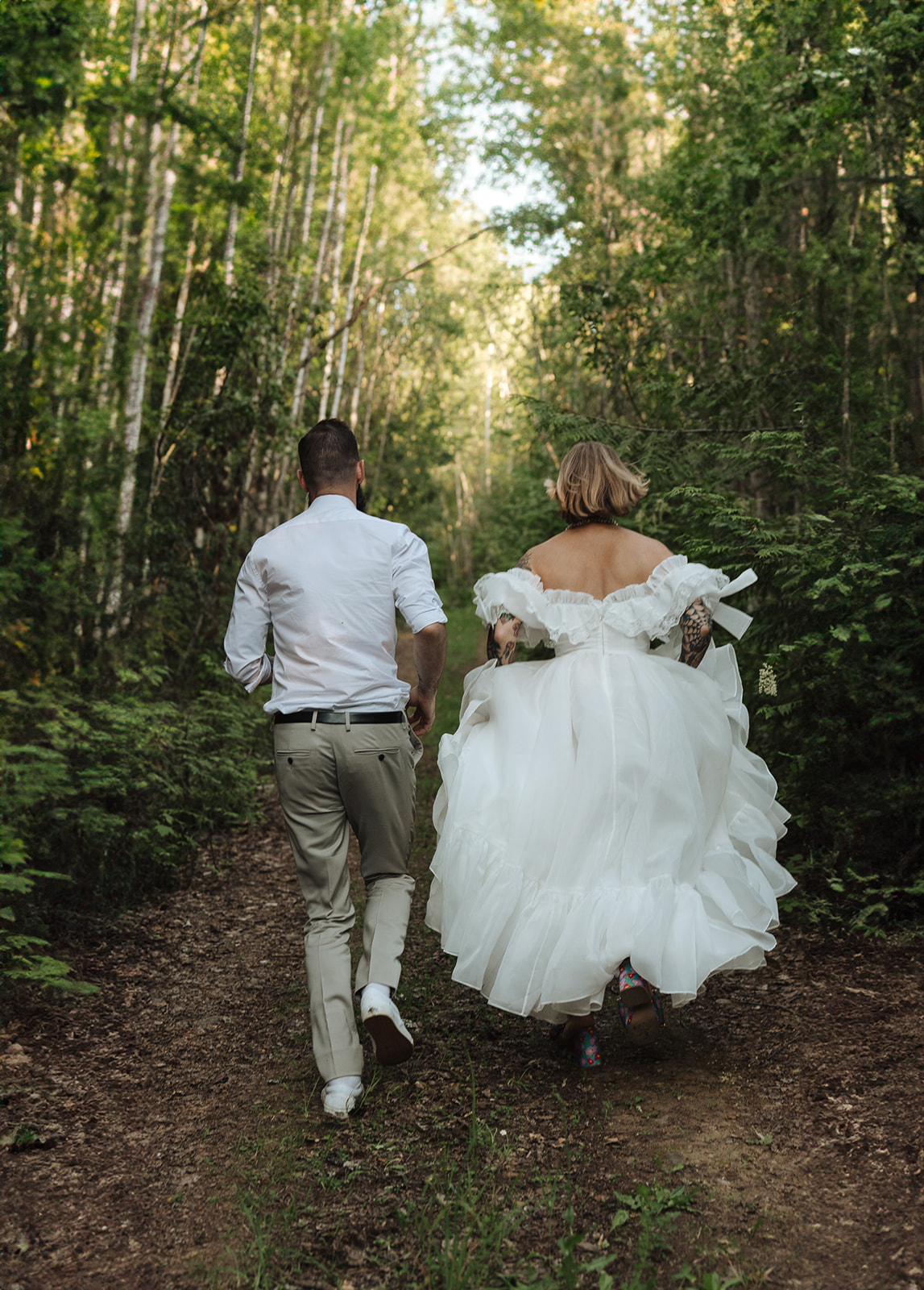 Cydney & Michael Bride in her wedding gown surrounded by the forest at Tin Poppy Retreat.