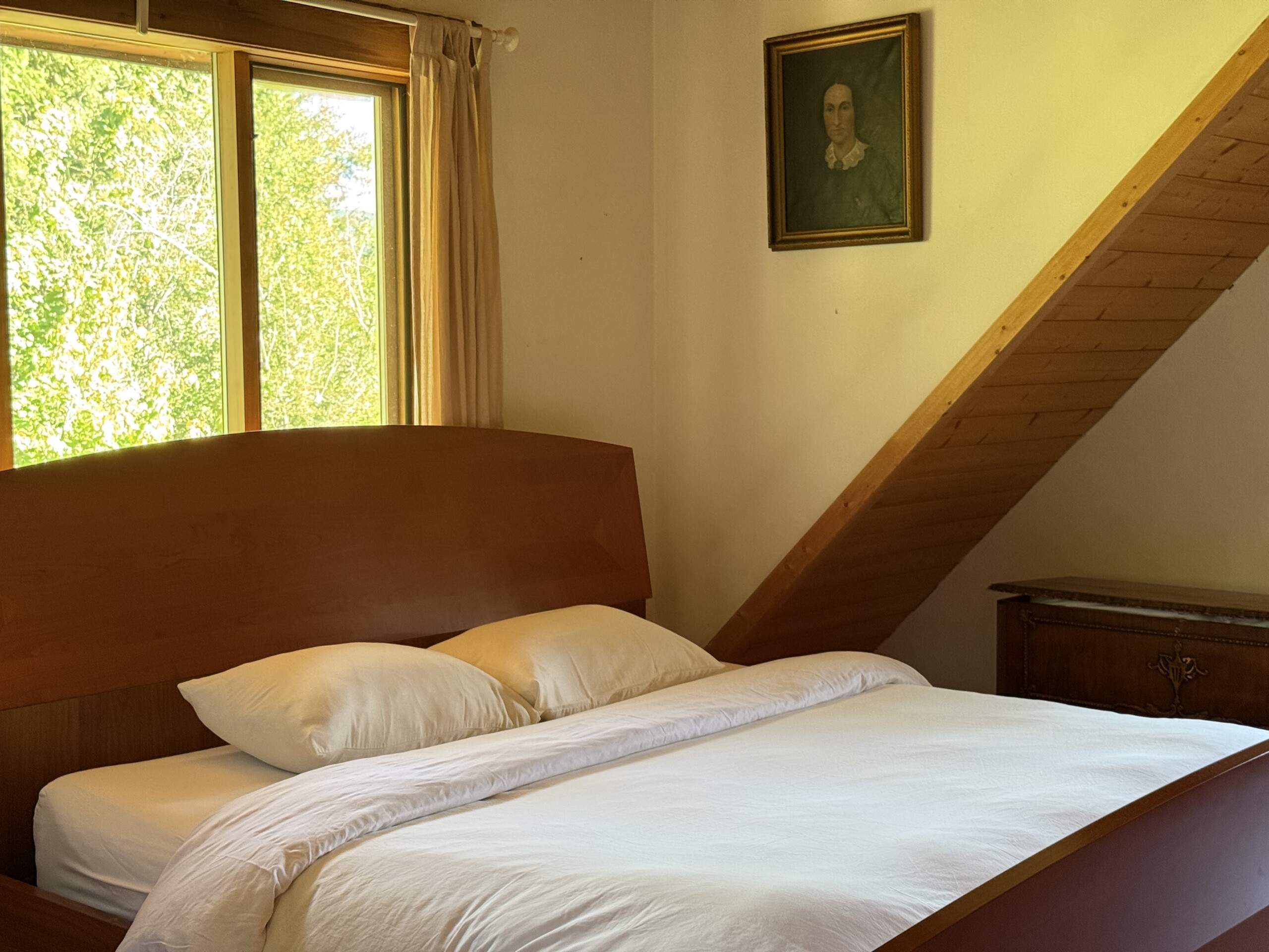 The king sized bed in Wild Rose Cabin near Salmon Arm, BC.